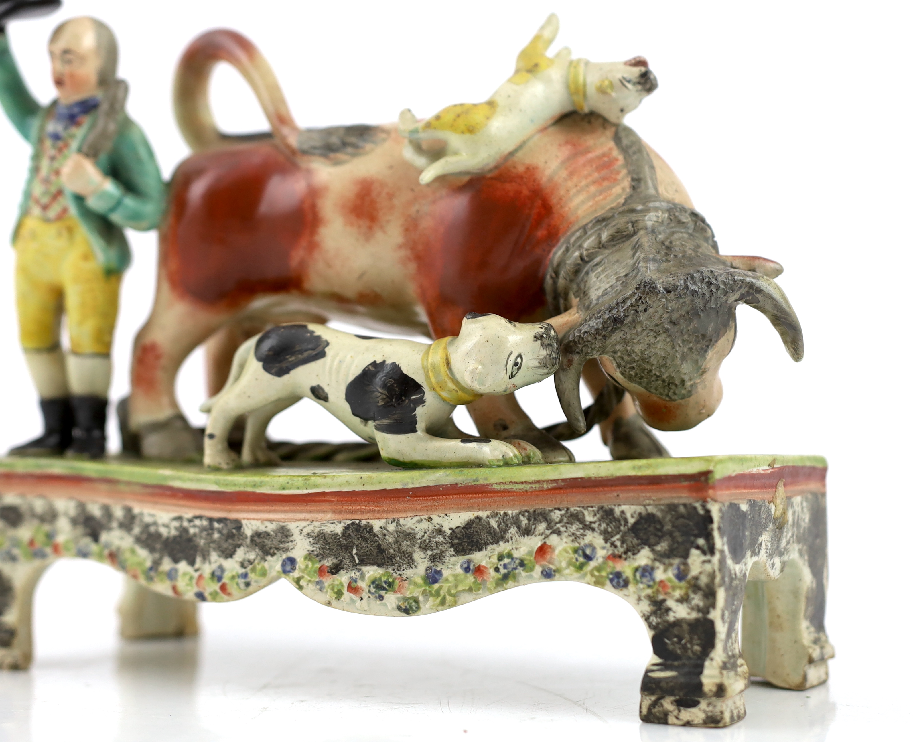 A Staffordshire pearlware bull baiting group, of Obadiah Sherratt type, c.1830, Some restoration